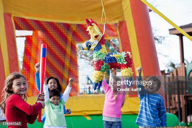 pinata at children's birthday party - bouncy castle stock pictures, royalty-free photos & images