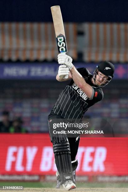 New Zealand's James Neesham plays a shot during the 2023 ICC Men's Cricket World Cup one-day international match between Australia and New Zealand at...