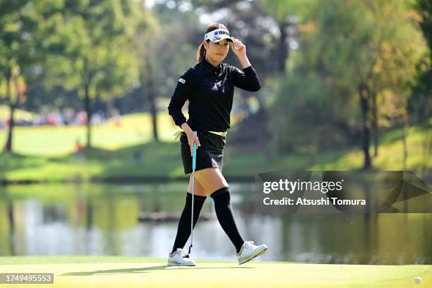 Mami Fukuda of Japan acknowledges the gallery after the birdie on the 15th green during the final round of NOBUTA Group Masters GC Ladies at Masters...