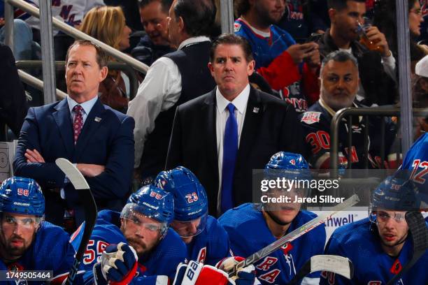 Head coach Peter Laviolette of the New York Rangers looks on from the bench against the Nashville Predators at Madison Square Garden on October 19,...