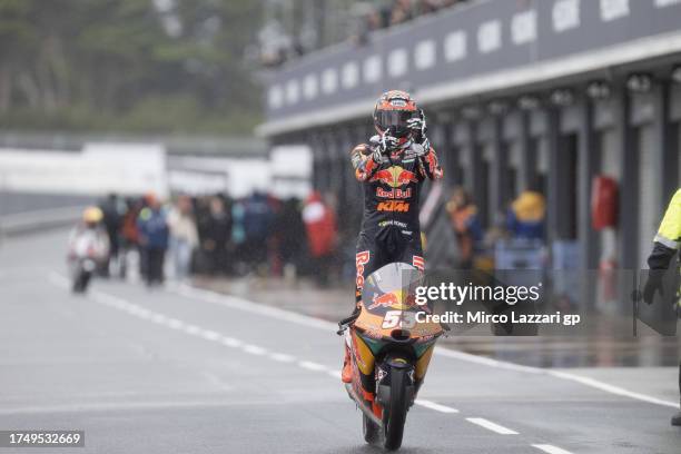 Deniz Oncu of Turkie and Red Bull KTM Ajo celebrates the victory in the pit during the Moto3 race during the 2023 MotoGP of Australia race at Phillip...