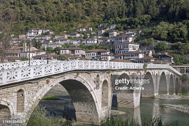 The old Ottoman Gorica Bridge over the Osum river in summer, landmark in the city Berat. Berati, southern Albania.