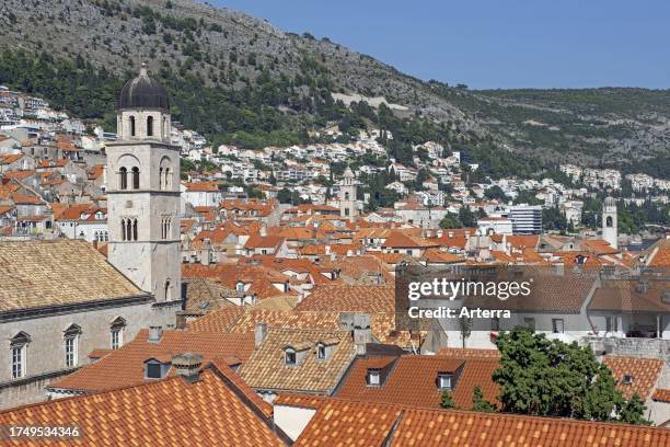 Red roofs of houses and bell tower of the Franciscan friary and church in the Old Town, historic city centre of Dubrovnik, southern Dalmatia, Croatia.