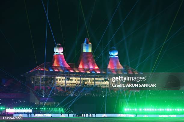 Light show is pictured at the end of the 2023 ICC Men's Cricket World Cup one-day international match between Australia and New Zealand at the...