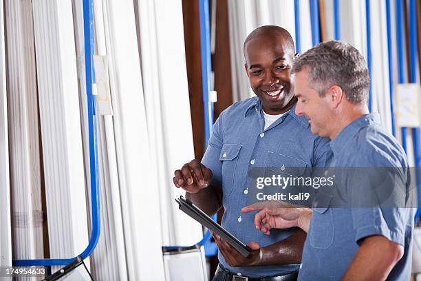 two men in building supply store - store manager stock pictures, royalty-free photos & images