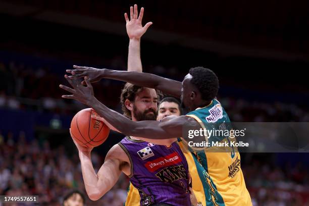 Jordan Hunter of the Kings wins the rebound under pressure from Majok Deng of the JackJumpers during the round four NBL match between Sydney Kings...