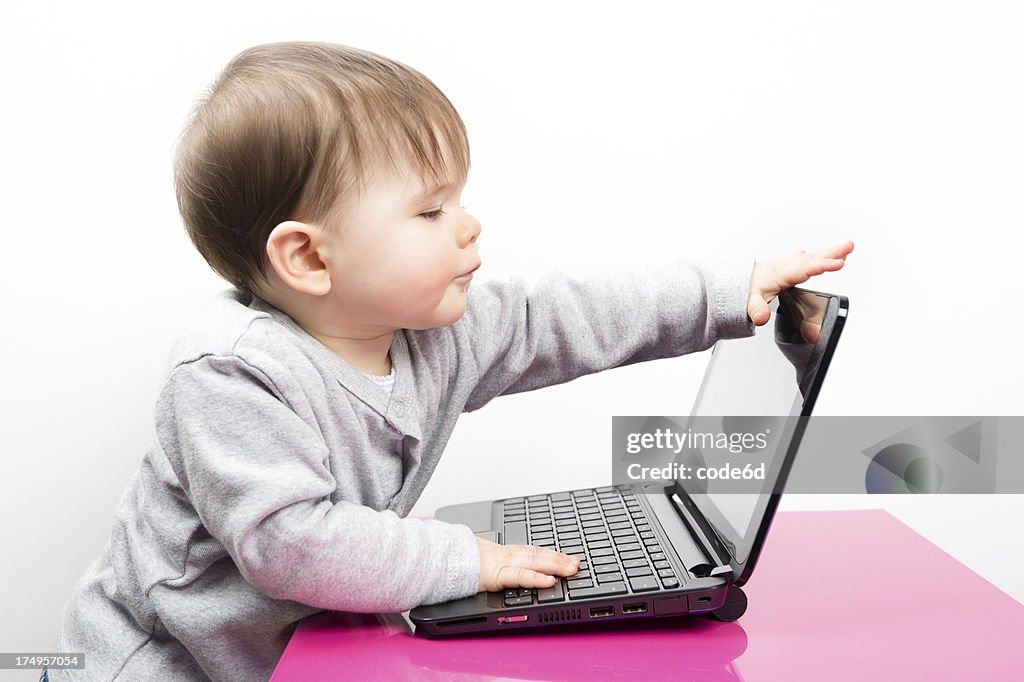 Baby Using A Computer Baby Girl Using A Laptop Computer Opening Lid High-Res Stock Photo ...