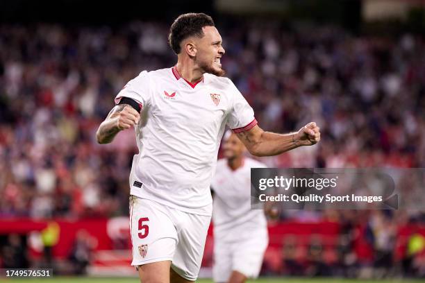 Lucas Ocampos of Sevilla FC celebrates as David Alaba of Real Madrid scores an own goal for their first goal during the LaLiga EA Sports match...