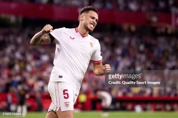 Lucas Ocampos of Sevilla FC celebrates as David Alaba of Real Madrid scores an own goal for their first goal during the LaLiga EA Sports match...