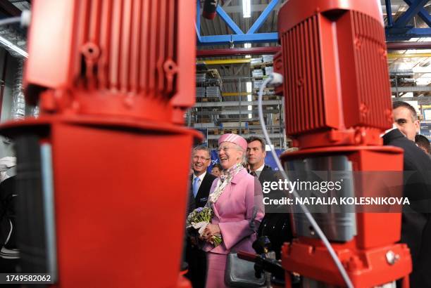 Queen Margrethe II of Denmark laughs during the opening ceremony of the newest expansion of the "Grundfos" factory in Istra, some 40 kms from Moscow...