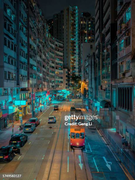 trams in the old district of hong kong island at night - spårväg bildbanksfoton och bilder