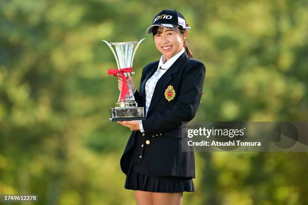 Nana Suganuma of Japan poses with the trophy after winning the tournament following the final round of NOBUTA Group Masters GC Ladies at Masters Golf...