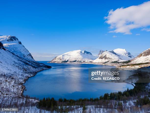 View over Bergsbotn, Bergsfjorden and Nordfjorden. The island Senja during winter in the north of Norway. Europe, Norway, Senja, March.