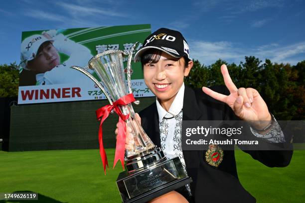 Nana Suganuma of Japan poses with the trophy after winning the tournament following the final round of NOBUTA Group Masters GC Ladies at Masters Golf...