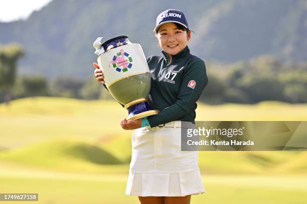 Nozomi Osuga of Japan poses with the trophy after winning the tournament following the final round of Salonpas Ladies Open on October 22, 2023 in...