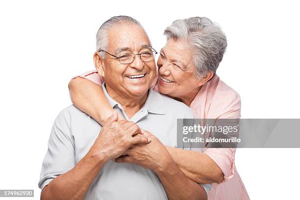 freundliche altes paar lachen zusammen - romantic couple on white background stock-fotos und bilder