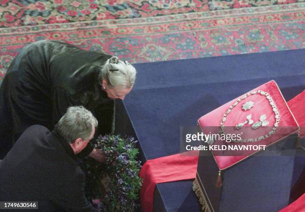Denmark's Queen Margrethe and Prince Consort Henrik lay a wreath at the coffin of Danish Queen Mother Ingrid in Christiansborg Palace Church in...