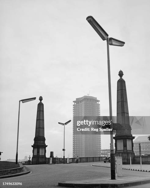 The Vickers Tower under construction, rising beyond the approach to the south side of Lambeth Bridge in London, England, 5th December 1961. Later...