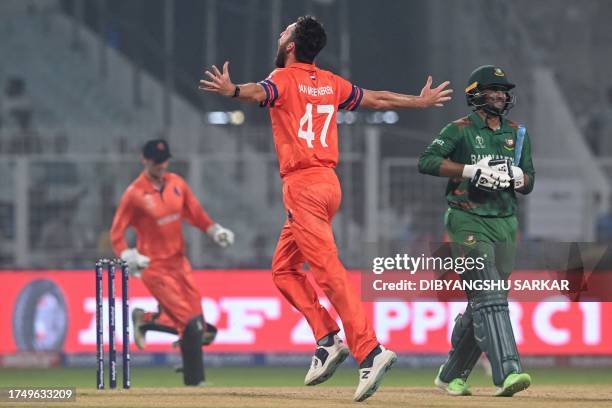 Netherlands' Paul van Meekeren celebrates after taking the wicket of Bangladesh's captain Shakib Al Hasan during the 2023 ICC Men's Cricket World Cup...