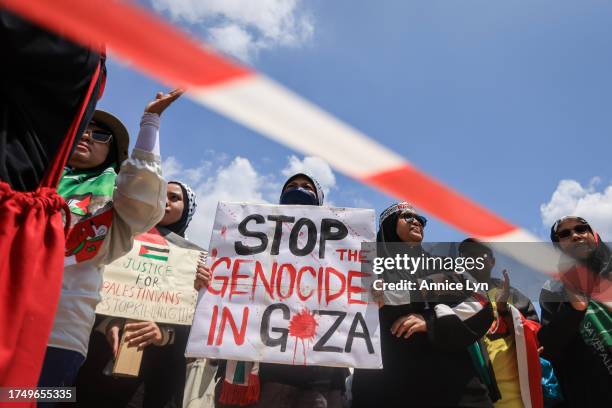 People gather during a Freedom for Palestine rally at Merdeka Square on October 22 in Kuala Lumpur, Malaysia. On October 7, the Palestinian militant...