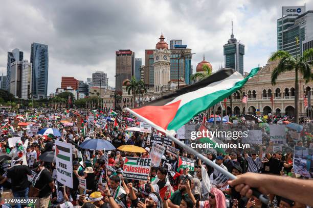 People gather during a Freedom for Palestine rally at Merdeka Square on October 22 in Kuala Lumpur, Malaysia. On October 7, the Palestinian militant...