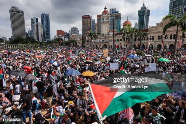 People gather during a Freedom for Palestine rally at Merdeka Square on October 22 in Kuala Lumpur, Malaysia. On October 7, the Palestinian militant...