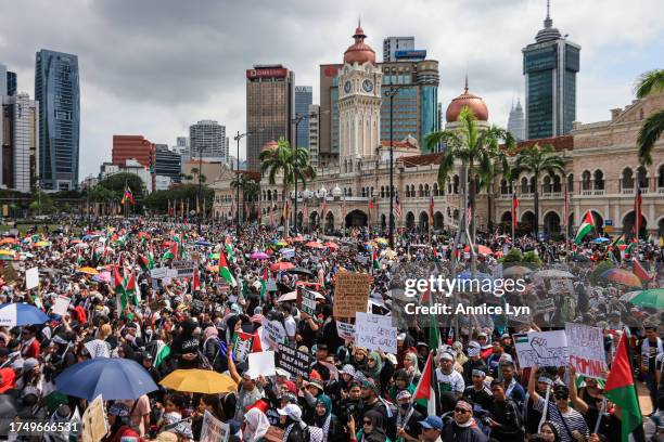 People gather during a Freedom for Palestine rally at Merdeka Square on October 22 in Kuala Lumpur, Malaysia. On October 7, the Palestinian militant...