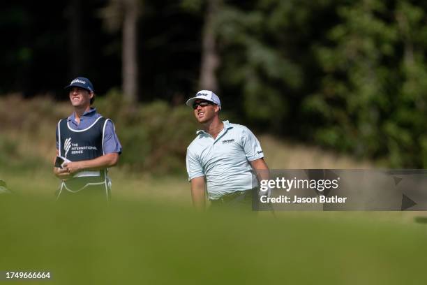 Andy Ogletree of the USA watches on with his caddie on hole 8 during the third round of the Asian Tour International Series England at Close House on...