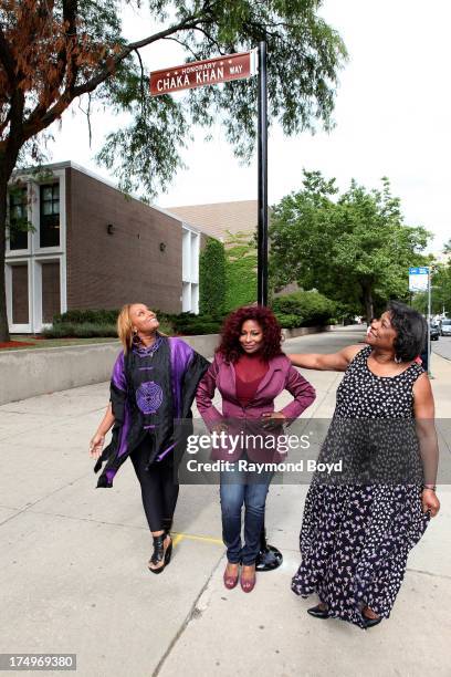 Singer Chaka Khan, poses under the street sign "Chaka Khan Way" with her sister and manager Tammy McCrary and her mother Sandra Coleman after...