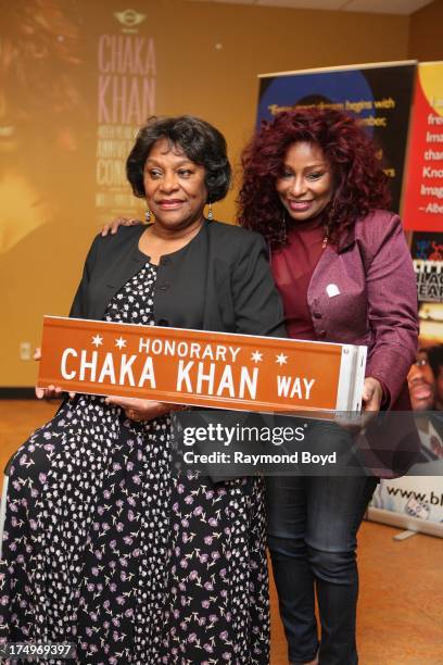 Singer Chaka Khan, poses with her mother Sandra Coleman with the street sign "Chaka Khan Way" after it was presented to her during a street renaming...