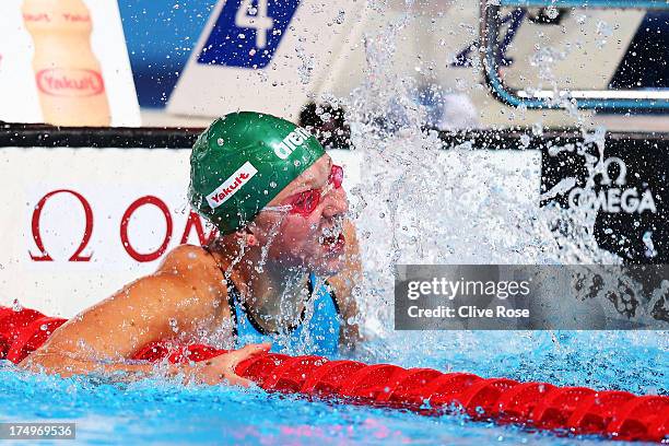 Ruta Meilutyte of Lithuania celebrates as she sets a new world record time of 1:04.35 in the Swimming Women's 100m Breaststroke Semifinal 2 on day...