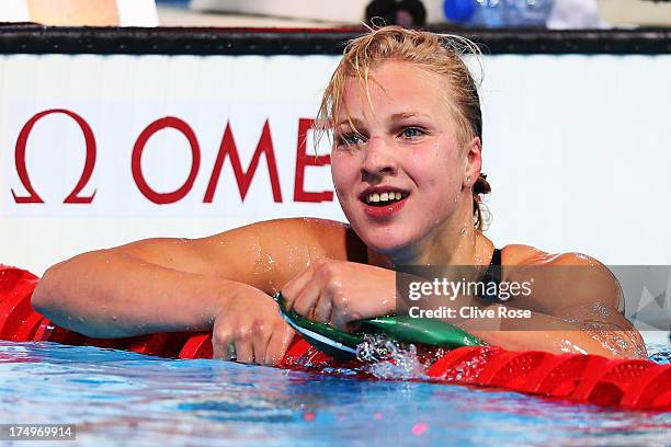 Ruta Meilutyte of Lithuania celebrates as she sets a new world record time of 1:04.35 in the Swimming Women's 100m Breaststroke Semifinal 2 on day...