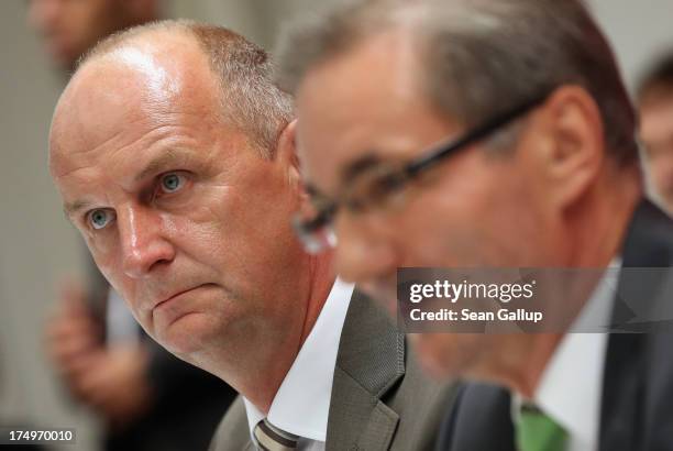 Brandenburg Governor and German Social Democrat Matthias Platzeck and Brandenburg State Minister of the Interior Dietmar Woidke arrive to speak to...