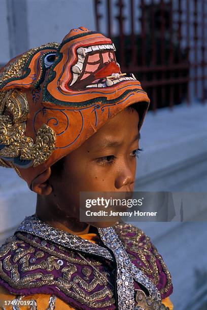 Thai boy wearing Khon during King's Birthday celebration of Ramakien dance..