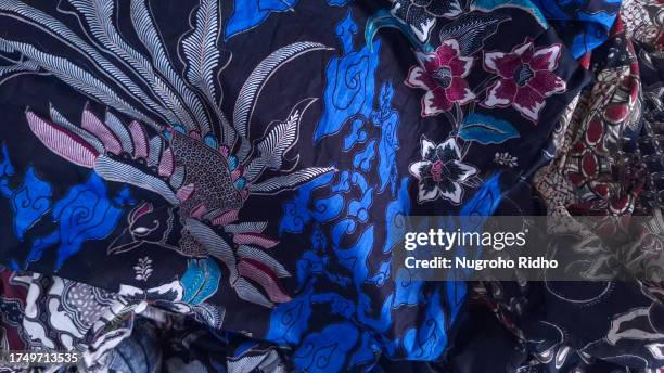 javanese batik animal and floral pattern - batik dress stock pictures, royalty-free photos & images