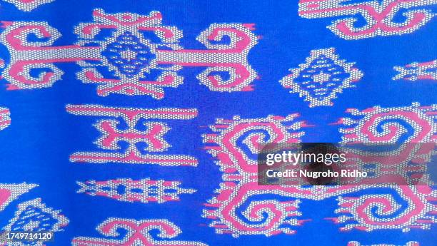 blue and red sumatera indonesia's songket ethnic pattern - batik indonesia stock pictures, royalty-free photos & images