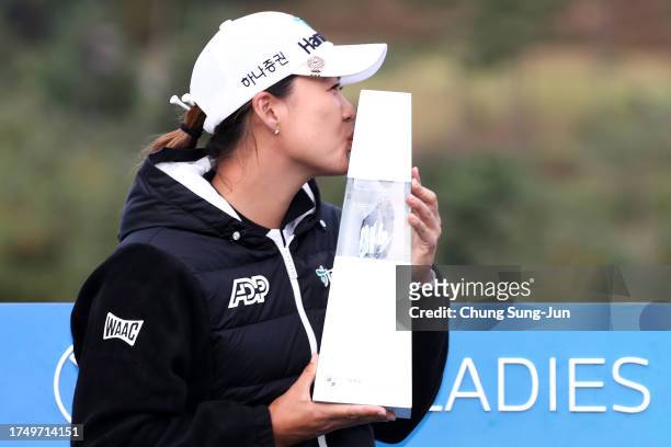 Minjee Lee of Australia kisses the trophy after winning the BMW Ladies Championship on the Seowon Hills course at Seowon Valley Country Club on...