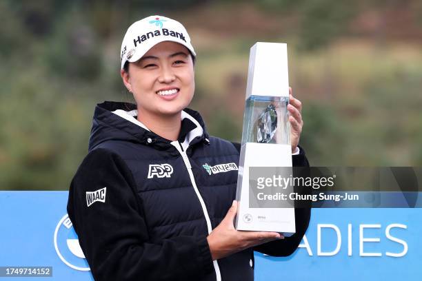 Minjee Lee of Australia celebrates with the trophy after winning the BMW Ladies Championship on the Seowon Hills course at Seowon Valley Country Club...