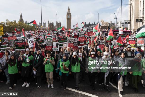 Tens of thousands of protesters march across Westminster Bridge in solidarity with the Palestinian people and to demand an immediate ceasefire to end...