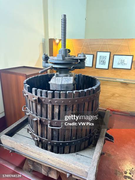 Vintage mechanical screw grape press for making wine in the Yancanelo Olive Oil Museum, San Rafael, Argentina.