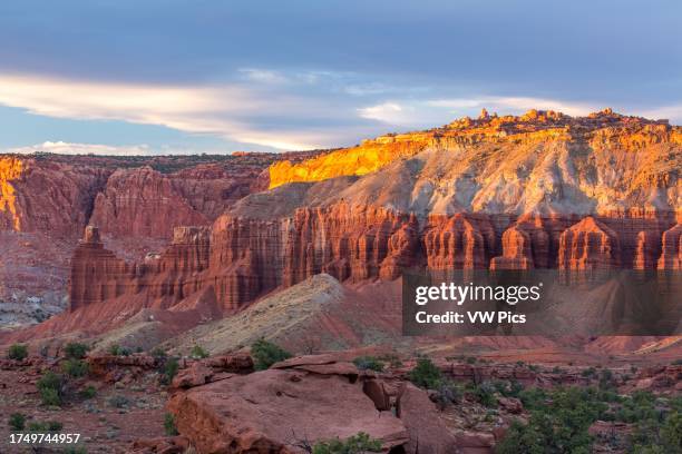 Sunset light on the Mummy Cliff from Panorama Point in Capitol Reef National Park in Utah. Chimney Rock is at far left.