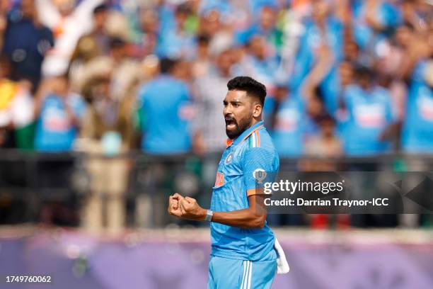 Shreyas Iyer of India celebrates the wicket of Devon Conway of New Zealand during the ICC Men's Cricket World Cup India 2023 match between India and...
