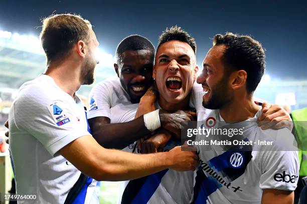 Lautaro Martinez of FC Internazionale celebrates with teammates after scoring his team's first goal during the Serie A TIM match between Torino FC...