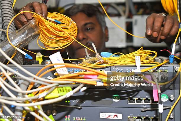 Telecom engineer checks the network link at the transmission room of BSNL Telephone Exchange office at Agartala. May 17th is the anniversary of the...