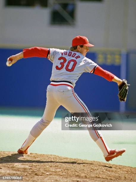 Pitcher John Tudor of the St. Louis Cardinals pitches against the Pittsburgh Pirates during a Major League Baseball game at Three Rivers Stadium...