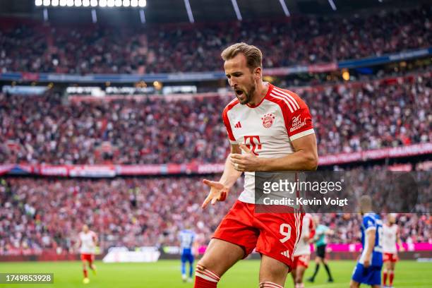 Harry Kane of FC Bayern Muenchen celebrates after scoring his team's first goal during the Bundesliga match between FC Bayern Muenchen and SV...