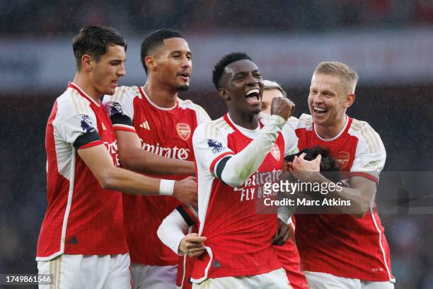 Eddie Nketiah, Oleksandr Zinchenko, William Saliba of Arsenal and Jakun Kiwior celebrate with Takehiro Tomiyasu during the Premier League match...