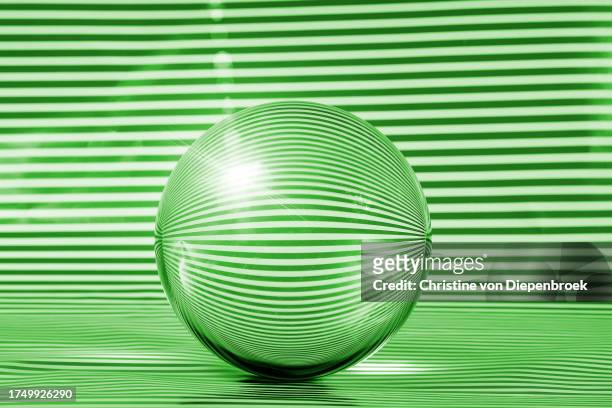 green glass-sphere with stripes - intercalated disc stock pictures, royalty-free photos & images