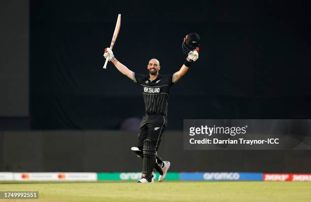 Daryl Mitchell of New Zealand celebrates their century during the ICC Men's Cricket World Cup India 2023 match between India and New Zealand at HPCA...