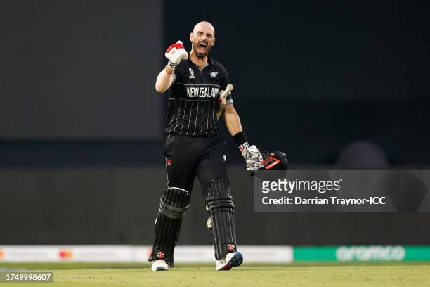 Daryl Mitchell of New Zealand celebrates their century during the ICC Men's Cricket World Cup India 2023 match between India and New Zealand at HPCA...